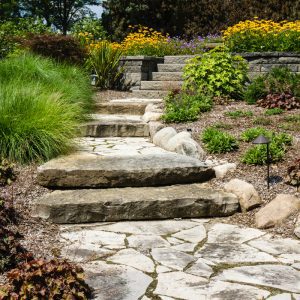 Image depicting rock stairs in a garden.